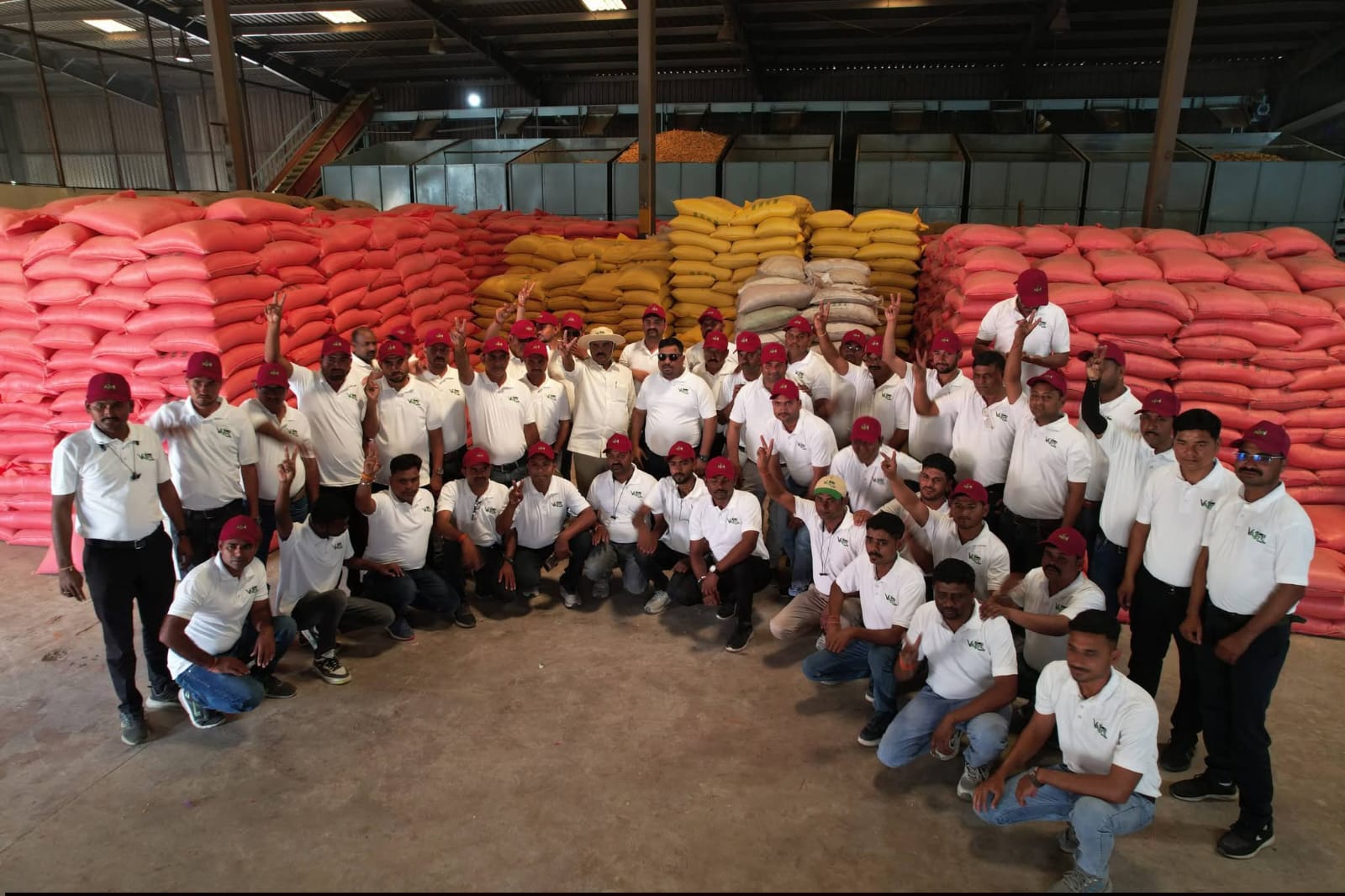 Team photo with packed seeds stock at warehouse